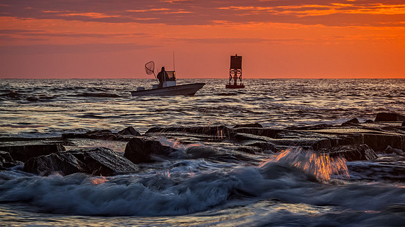 fisherman at sunset, indian river inlet, de